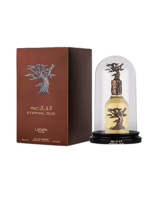 Frasco de perfume Lattafa Eternal Oud con un árbol decorativo de bronce en su interior, exhibido bajo una cúpula de cristal protectora sobre una base negra